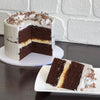 chocolate mud cake with white chocolate ganache and salted caramel sauce. Decorated with swiss meringue buttercream, caramel crispearls and chocolate shavings